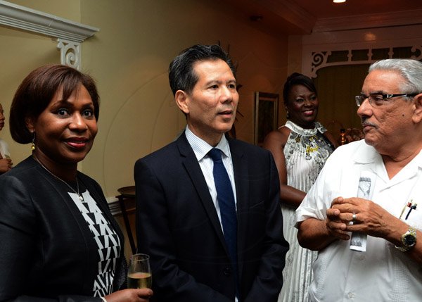 Winston Sill/Freelance Photographer
USAID/Jamaica host Appreciation Reception for their various partners and the private sector, for over 52 years, held at the Knutsford Court Hotel, Ruthven Road on Tuesday night December 9, 2014. Here are Lissa Grant (left); Anthony Chang (centre); and Jimmy Moss-Solomon (right).
