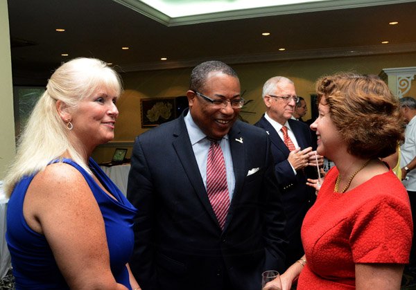 Winston Sill/Freelance Photographer
USAID/Jamaica host Appreciation Reception for their various partners and the private sector, for over 52 years, held at the Knutsford Court Hotel, Ruthven Road on Tuesday night December 9, 2014.  Here are Denise Herbol (left), Mission Director, USAID; Minister Anthony Hylton (centre); and Elizabeth Martinez (right), Charge d' Affaires, US Embassy.