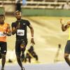 Ricardo Makyn/Staff Photographer 
 From left Dwight White of GC Foster College,Kim Collins race ahead as Yohan Blake pulls up while feeling cramps in the Men's  100 Meter    at the Utech Classic's held at the National stadium on Saturday 13.4.2013