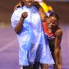 Ricardo Makyn/Staff Photographer.
Sherone Simspon being assisted by medical staff after  pulling up in the the Womens 400 Meter   at the Utech Classics held at the National Stadium on Saturday 15.4.2012
