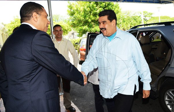 Rudolph Brown/Photographer
Prime Minister Andrew Holness,(left) greets Nicolás Maduro, (right) the President of the Bolivian Republic of Venezuela at Jamaica House during a Working Visit to Jamaica on Sunday, May 22, 2016