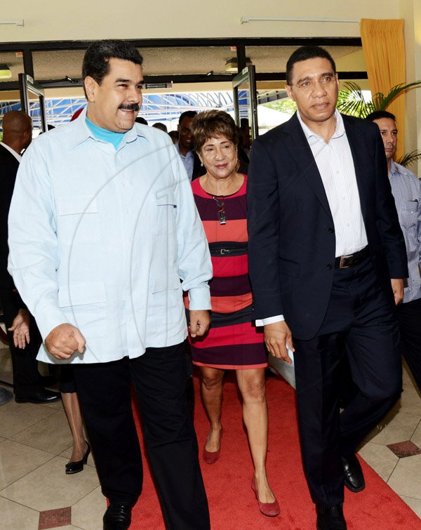 Rudolph Brown/Photographer
Prime Minister Andrew Holness,(right) chat with Nicolás Maduro, (left) the President of the Bolivian Republic of Venezuela at Jamaica House during a Working Visit to Jamaica on Sunday, May 22, 2016