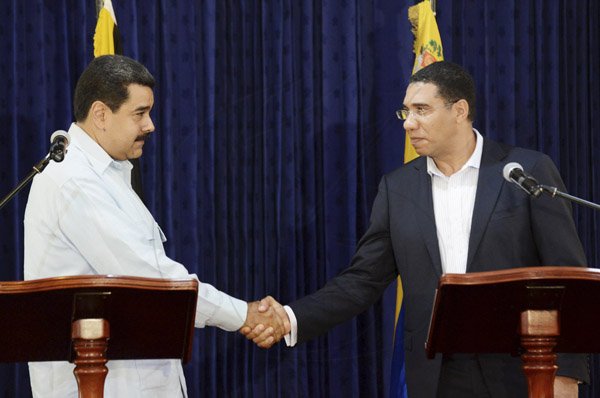 Rudolph Brown/Photographer<\n>Prime Minister Andrew Holness,(right) shakes hand with Nicolás Maduro, (left) the President of the Bolivian Republic of Venezuela at Jamaica House during a Working Visit to Jamaica on Sunday, May 22, 2016