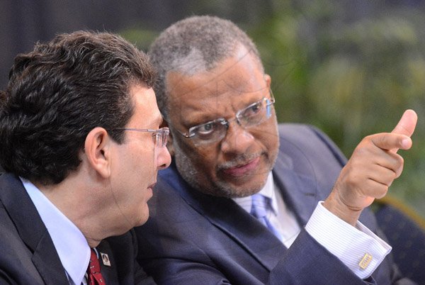 Rudolph Brown/Photographer
Business Desk
Dr Peter Phillips, (right) Minister of Finance Planning and Public Service in discussion with Joseph M. Matalon, Chairman of Development Bank of Jamaica at the Venture Capital One Day Conference at Jamaica Pegasus Hotel in New Kingston on Monday, September 9,2013