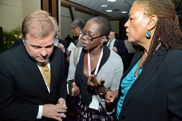 Rudolph Brown/Photographer
Business Desk
Guest speaker Paul Ahlstrom, Managing Director of Alta Ventures Mexico, Alta Group Americas in discussion with Dr. Blossom O’Meally Nelson, (left) and Enith Williams at the Venture Capital One Day Conference at Jamaica Pegasus Hotel in New Kingston on Monday, September 9,2013