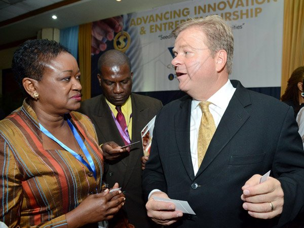 Rudolph Brown/Photographer
Business Desk
Guest speaker Paul Ahlstrom, (right) Managing Director of Alta Ventures Mexico, Alta Group Americas in discussion with Minna Israel and Norman Grant at the Venture Capital One Day Conference at Jamaica Pegasus Hotel in New Kingston on Monday, September 9,2013
