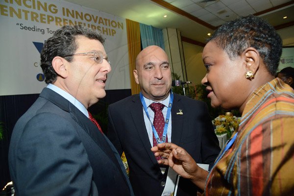 Rudolph Brown/Photographer
Business Desk
Minna Israel chat with PSOJ president Christopher Zacca (centre) and Joseph M. Matalon Chairman of Development Bank of Jamaica at the Venture Capital One Day Conference at Jamaica Pegasus Hotel in New Kingston on Monday, September 9,2013