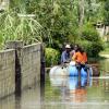 Photo by Christopher Thomas

Residents of New River near Santa Cruz, St. Elizabeth use a makeshift raft to make their way along the flooded sections of the community. New River experienced flooding following the heavy rains caused by Tropical Storm Nicole.