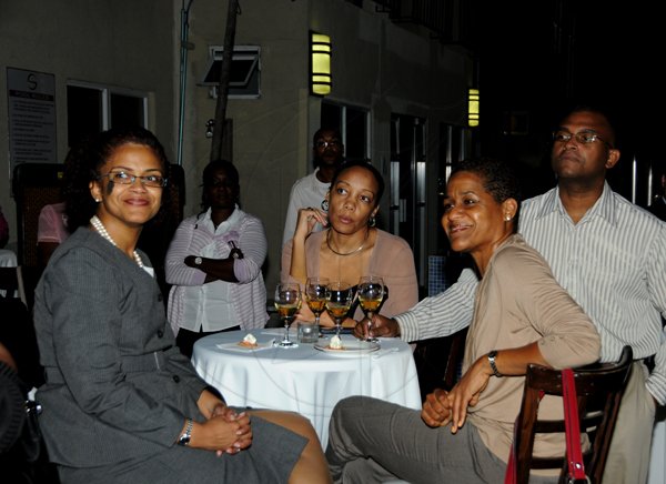 Winston Sill / Freelance Photographer
Spanish Court Hotel and J. Wray and Nephew  presents Wine Tasting Mondays, held at Spanish Court Hotel, St. Lucia Avenue, New Kingston on Monday night November 26, 2012. Here are Suzanne Donalds (left); Janelle Brown (centre); Sean Donalds (right); and Demaris Mayne (fore ground).