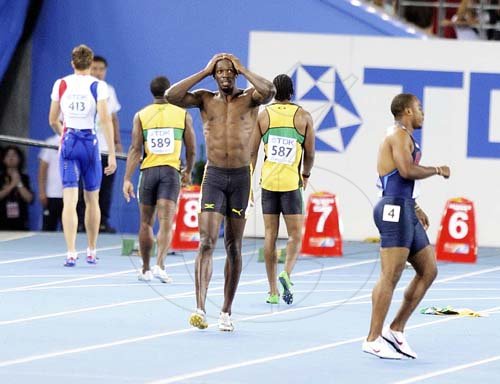 Ricardo Makyn/Staff Photographer 
Usain Bolt reacts after his false start in the men's 100m final in Daegu, South Korea.