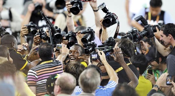 BOLT MEDIA FRENZY

Ricardo Makyn/Staff Photographer
The presss just love Usain Bolt, here he was swamped by reporters and photographers after winning the  gold medal in the men's 200 meters final in Daegu yesterday.