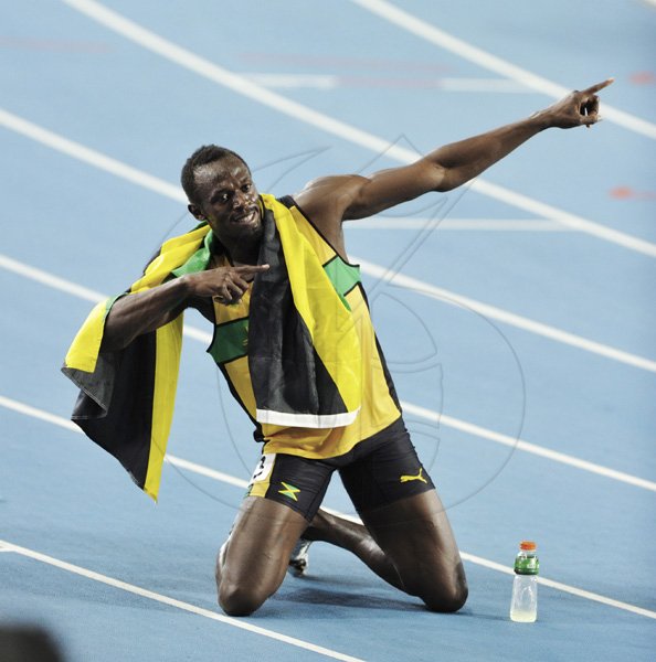 Ricardo Makyn/Staff Photographer
Jamaica's Usain Bolt celebrates with his now familiar pose after winning the men's 200 metres gold in the fourth fastest time in history at the IAAF World Championships in Daegu yesterday. Bolt crossed the line in 19.40 seconds beating American Walter Dix, 19.70, into second place.  







Usaine Bolt winning the gold medal in the men's 200 meters final, Daegu September 3, 2011.r