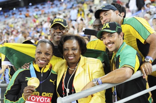Ricardo Makyn/Staff Photographer
Minister of Sports, Olivia 'Babsy' Grange and  other Jamaicans celebrating in Daegu pose with a victorious Veronica Campbell-Brown,  after she received her gold medal, Daegu yesterday.