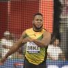 Traves Smikle competes in the discus throw event at the