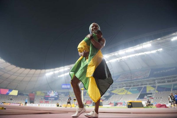 100m Women world champion Shelly-Ann Fraser Pryce celebrates win with son Zion at the  2019 IAAF World Athletic Championships held at the Khalifa International Stadium in Doha, Qatar on Sunday September 29, 2019.