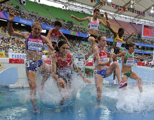 Ricardo Makyn/Staff Photographer
Jamaica's Mardrea Hyman (second right) clears the barrier while competing in heat two of the women's SteepleChase, at the World Athletics Championships in Daegu, South Korea, yesterday. Hyman failed to finish.