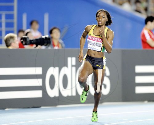 Ricardo Makyn/Staff Photographer
Jamaica Novlene Williams Mills, ahead in the womens 400 meters.