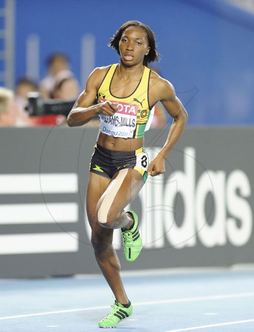Ricardo Makyn/Staff Photographer
Jamaica Novlene Williams Mills, ahead in the womens 400 meters.