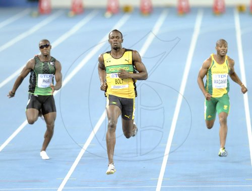 Ricardo Makyn/Staff Photographer
Jamaica's Usain Bolt (centre) eases across the finish line ahead of South Africa's Simon Magakwe (right) and?Zambia's Gerald Phiri, in a heat of the men's 100m at the World Athletics Championships in Daegu, South Korea, yesterday.


, Aug. 27, 2011. (AP Photo/Anja Niedringhaus)