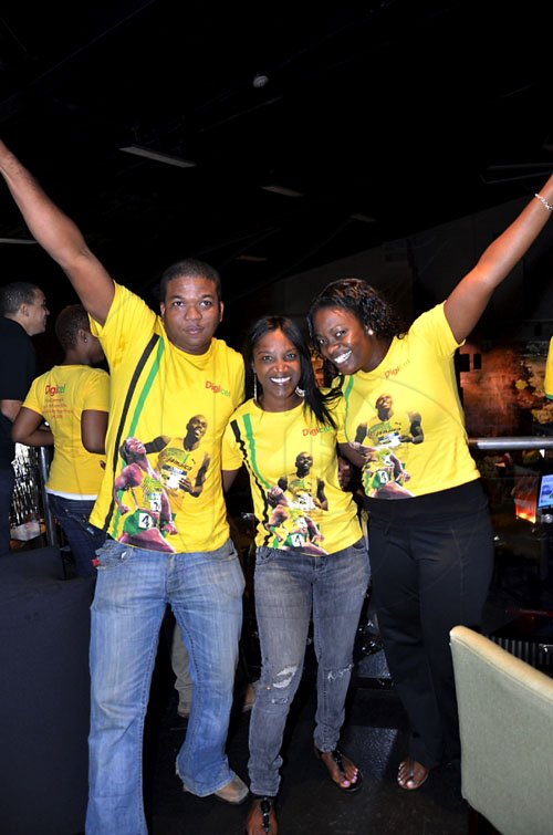 Contributed

 ?To Di World? Digicel?s Sponsorship team (from left) Benjamin Simms, sponsorship executive; Paula Pinnock-MacLeod, sponsorship manager and Carla Hollingsworth, sponsorship executive,  radiate excitement as Jamaica created history by winning the men?s 4x100M relay and setting a new woorld record of 37.04 at the World Championships in Daegu, South Korea yesterday. The Digicel team was watching the races at Usain Bolt Tracks and Records.