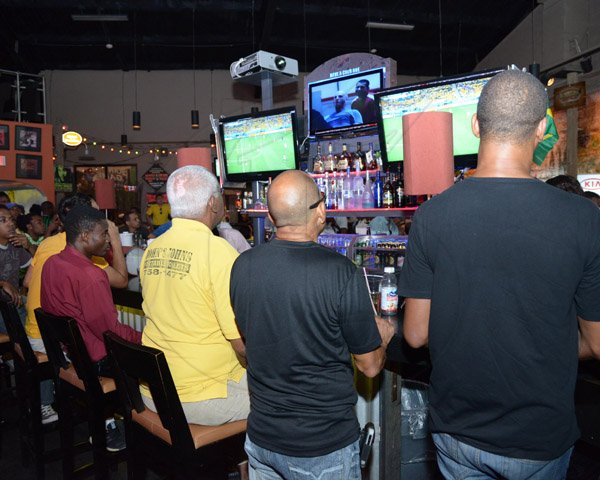 Ian Allen/Staff Photographer
Patrons at the Usain Bolt Track N Records watching the opening match of Woeld Cup 2014 between Brazil and Croatia on Thursday.