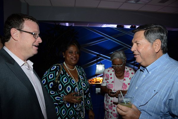 Winston Sill/Freelance Photographer
PUBLIC AFFAIRS and BUSINESS DESKS:----- J Wray and Nephew Limited, a Gruppo Campari Company present the Official Opening of the JWN Corporate Office,  at Dominica Drive, New Kingston on Thursday night April 10, 2014. Here are Paul Henriques (left); Lisa Bell (second left); Marjorie Kennedy (second right); and Brian Pengelley (right).