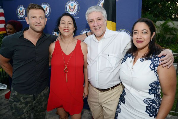 Rudolph Brown/PhotographerUS Ambassador to Jamaica Luis G. Moreno (second right) pause from his candid banter to indulge in a quick photo op with (from left) Chase Jarvis, Jo-ann and Johnelle Causewell.