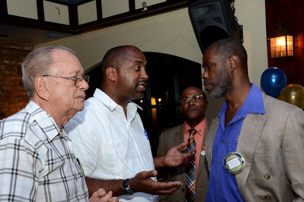 Winston Sill/Freelance Photographer
The Rotary Club of New Kingston host "Media Lyne", held at Courtleigh Hotel, New Kingston on Tuesday night August 12, 2014.  Here are Hilary Jardine (left); Minister Julian Robinson (second left); Club President Lloyd Butler (second right); and Prof. Marvin Reid (right).
