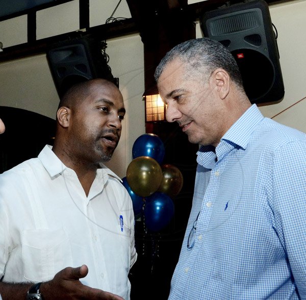 Winston Sill/Freelance Photographer
The Rotary Club of New Kingston host "Media Lyne", held at Courtleigh Hotel, New Kingston on Tuesday night August 12, 2014. Here are Minister Juian Robinson (left); and Jason Sharpe (right), Director, Coffee Traders Limited.