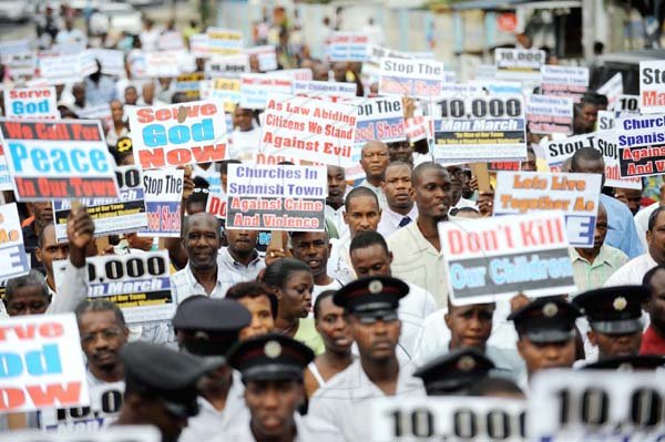 10,000-man march flops, sizzles

Ricardo Makyn/Staff Photographer
Placard-bearing participants march from Greendale to Spanish Town proper in a demonstration against criminality and donmanship in Jamaica. Billed as the 10,000-man march, only a few hundred persons turned out to support the church-led initiative. Story on Page A3.

10,000 Men March in Spanish Town on Sunday 11.4.2010.