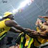Ricardo Makyn/Staff Photographer 
Rio 2016 Olympics

Usain Bolt is congratulated by adoring fans after his 100m victory at the Olympics in Rio de Janeiro, Brazil, yesterday.