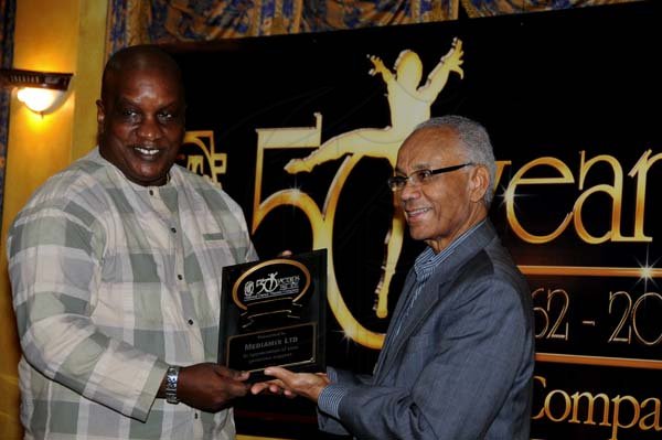 Winston Sill / Freelance Photographer
National Dance Theatre Company (NDTC) 50th Anniversary Awards Ceremony, held at Mona Visitors' Lodge, UWI, Mona on Sunday night October 28, 2012. Here are Lennie Little-White (l;eft); and Dr. Carlton Davis (right).