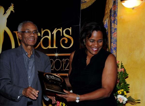 Winston Sill / Freelance Photographer
National Dance Theatre Company (NDTC) 50th Anniversary Awards Ceremony, held at Mona Visitors' Lodge, UWI, Mona on Sunday night October 28, 2012. Here are Dr, Carlton Davis (left); and Michelle Pollard-Gonzalez (right), Executive, Jamaica National..