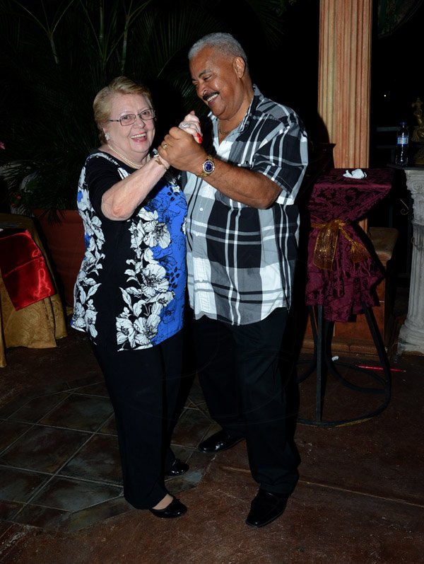 Winston Sill/Freelance Photographer
The Latin American Women's Club host fundraising St. Valentine 
`Baila Amor Dance Party, held at Mongomery Road, Stony Hill on Friday night February 21, 2014. Here are Maria Pinchin (left); and Tony Walker (right) dancing.