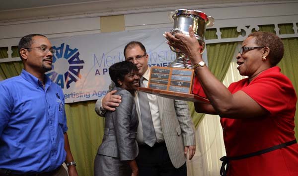 Rudolph Brown/Photographer
The Gleaner Company Advertising team collect the winning advertising media award from Sir Patrick Allen, Governor General of Jamaica at the AAAJ Media Awards luncheon at the Knutsford Court Hotel in New Kingston on Wednesday, July 13-2011