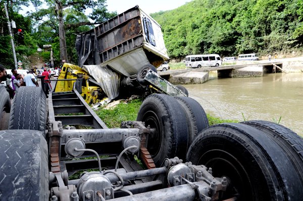 Norman Grindley/Chief Photographer
Forty-five year-old Michael Nicholas and his son, 18-year-old Travis, are among three men who died wednesday night when their trailer plunged into the Rio Cobre.