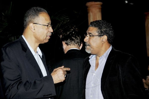 Winston Sill / Freelance Photographer
Kenny Benjamin host the American Friends of Jamaica (AFJ) at Dinner, held at Montgomery Road, Stony Hill on Tuesday night April 16, 2013. Here are Rev.----????? (left), US Ambassador Pamela Bridgewater's husband; and Minister Wykeham McNeill (right).