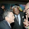 Rudolph Brown/Photographer
Lascelles Chin (left) chat with King Accra Nii Kpobi Tettey, Tsuru III (right) of Ghana and Amarkai Amarteifio, (centre) Lawyer and Consul of Sweden in Ghana at Admark 50th Anniversary Banquet at  at the Jamaica Pegasus on Tuesday, April 14