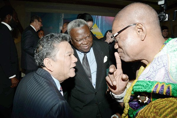 Rudolph Brown/Photographer
Lascelles Chin (left) chat with King Accra Nii Kpobi Tettey, Tsuru III (right) of Ghana and Amarkai Amarteifio, (centre) Lawyer and Consul of Sweden in Ghana at Admark 50th Anniversary Banquet at  at the Jamaica Pegasus on Tuesday, April 14