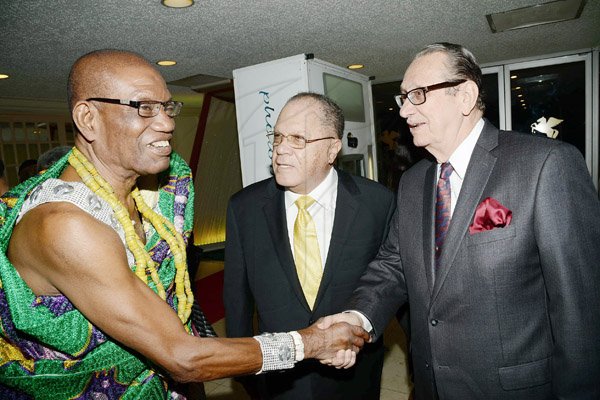 Rudolph Brown/Photographer
R Danny Williams, (right) and Arnald Foote greets King Accra Nii Kpobi Tettey, Tsuru III (left) of Ghana at Admark 50th Anniversary Banquet at the Jamaica Pegasus on Tuesday, April 14