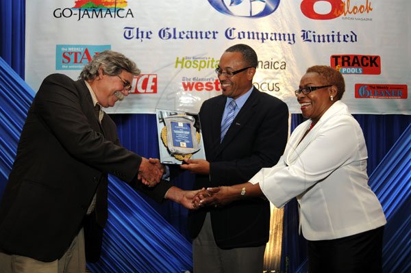 Gladstone Taylor / Photographer

Wayne Stewart (left) president of the Advertising Agencies Association of Jamaica, accepts a Jamaica 50 Award, celebrating the agency's 50th anniversary from Gleaner Managing Director Christopher Barnes and the company's Business Development and Marketing Manager Karin Cooper.

Jamaica Gleaner hosts advertisers appreciation and agency awards luncheion held at the jamaica Pegasus, kingston