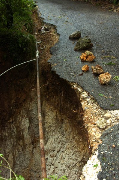 Norman Grindley/Chief Photographer
A section of road in Halls Delight St. Andrew that was cut away by flood waters on Wednesday September 29 , 2010.