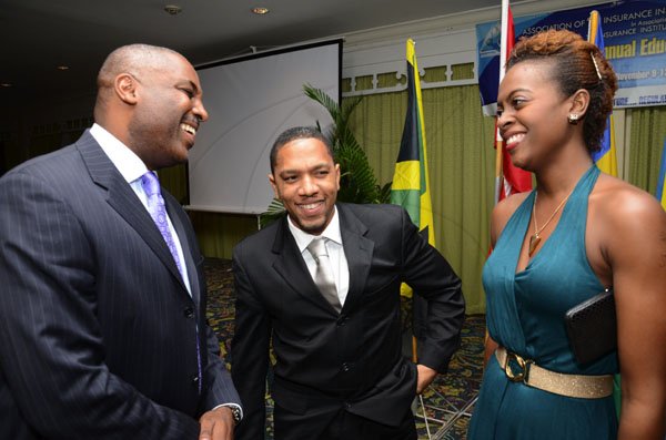 Rudolph Brown/Freelance Photographer
The official opening and cocktail of the Association of Insurance Institute of?Caribbean AIIC 14th Annual Insurance education conference for Caribbean host by Insurance Institute of Jamaica at the Knutsford Court Hotel in Kingston on Wednesday, November 9-2011.
Rohan Barnett, (left)?of?FSC chat with Randy Graham, president of Association of Insurance Institute of the Caribbean and Janelle Thompson.