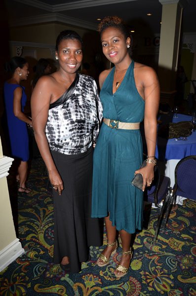 Rudolph Brown/Freelance Photographer
The official opening and cocktail of the Association of Insurance Institute of?Caribbean AIIC 14th Annual Insurance education conference for Caribbean host by Insurance Institute of Jamaica at the Knutsford Court Hotel in Kingston on Wednesday, November 9-2011.
Glasmine Hibbert-Lindsay, (left) pose with Janelle Thompson.?