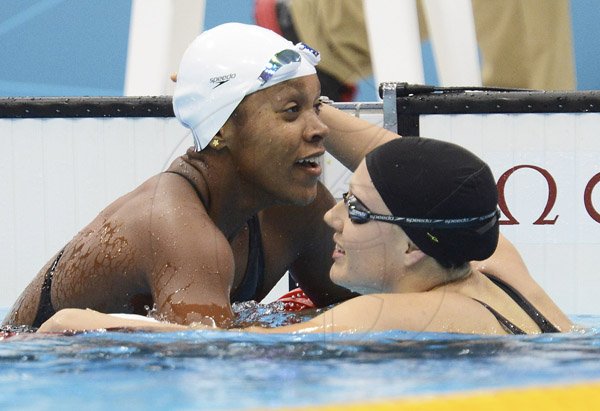 Ricardo Makyn/Staff Photographer
Alia (left) is being congratulated by Canadian
Tera Van Beilen at the Aquatic Centre Olympic Park in the Semifinal