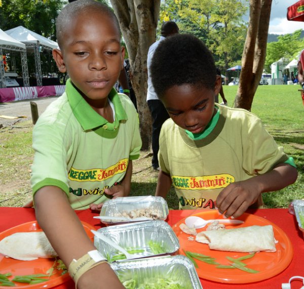 Rudolph Brown/Photographer
Mini Chefs Dominic Minott, (left) and Naasir Aswan  contest the Reggae Jammin Kids Grill-Off at All Jamaica Grill Off at Hope Gardens on Sunday, June 9, 2013