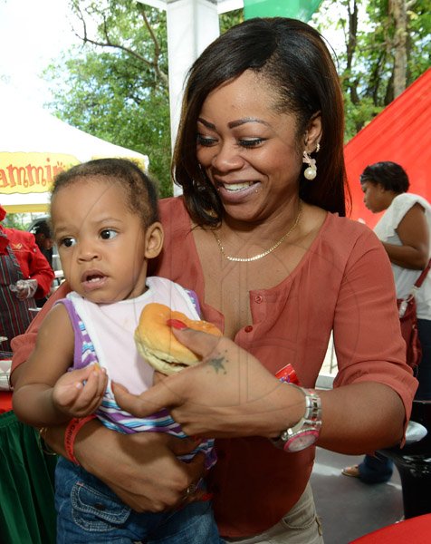 Rudolph Brown/Photographer
Denise Cunningham with baby Aliah Richards at All Jamaica Grill Off at Hope Gardens on Sunday, June 9, 2013