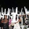 Jermaine BarnabyPhotographerRain did not stop the party, as plastic chairs were used as makeshift umbrellas. *** Local Caption *** Jermaine BarnabyPhotographerRain did not stop the party, as plastic chairs were used as makeshift umbrellas.