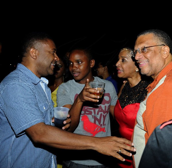 Winston Sill / Freelance Photographer
Angela Amir host a party to celebrates her Birthday in fine style with family and friends, held at Mahoe Avenue, Long Mountain on Saturday night December 15, 2012. Here are Minister Phillip Paulwell (left); Kamal Powell (second left); Angela Amir (second right); and Minister Peter Phillips (right).