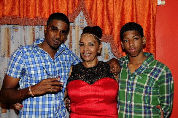 Winston Sill / Freelance Photographer
Angela Amir host a party to celebrates her Birthday in fine style with family and friends, held at Mahoe Avenue, Long Mountain on Saturday night December 15, 2012. Here are Angela Amir (centre) with her two sons, Yannick (left); and Royan (right).